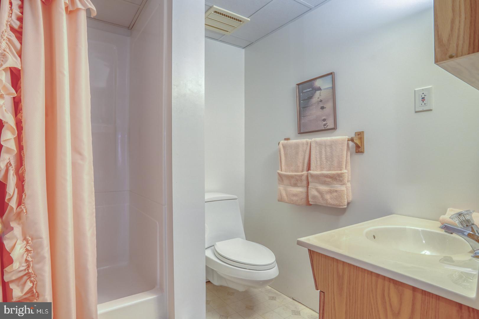 20 Tammie Drive Bear, DE 19701 - Photo 31 of 37 a bathroom with a sink toilet and vanity