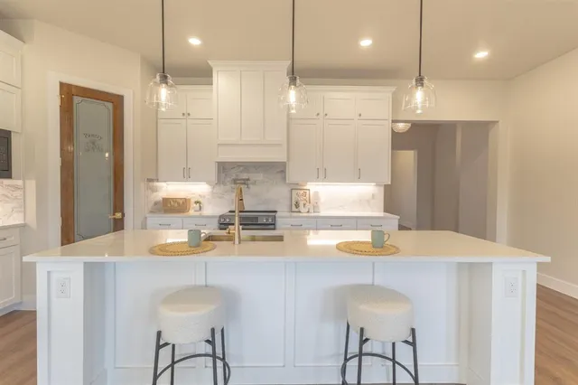 a kitchen with a table and chairs in it