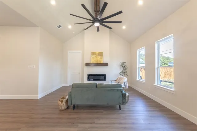 a living room with a couch and a window