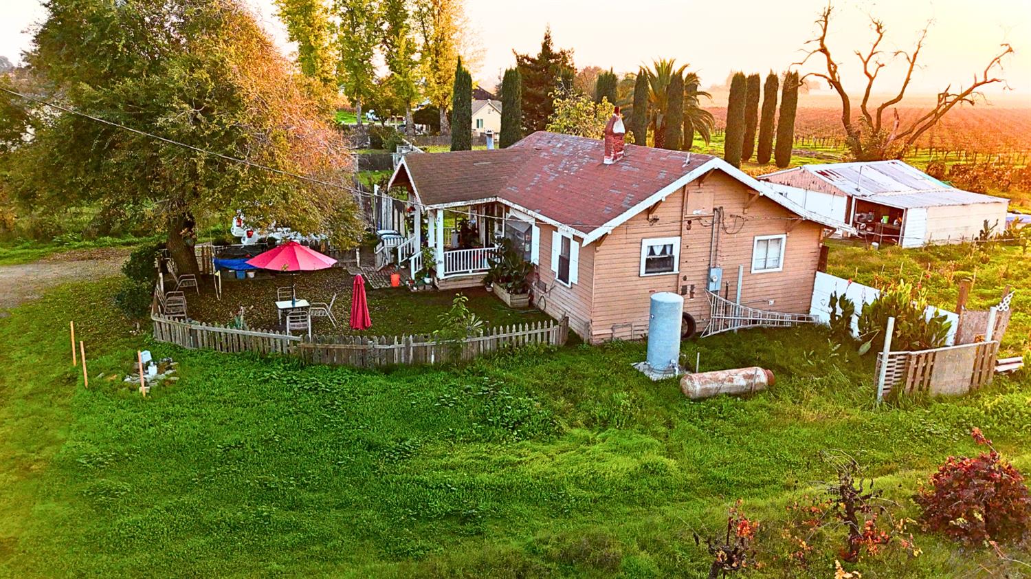 19217 Devries Road Lodi, CA 95242 - Photo 2 of 5 a view of a house with a yard and a garden
