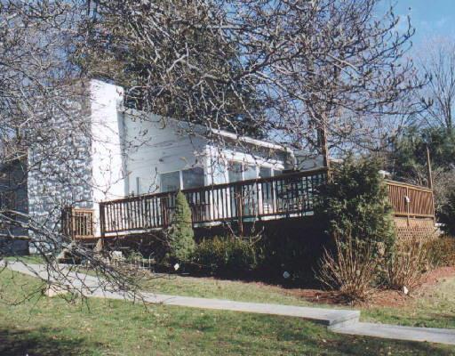 a view of house with yard