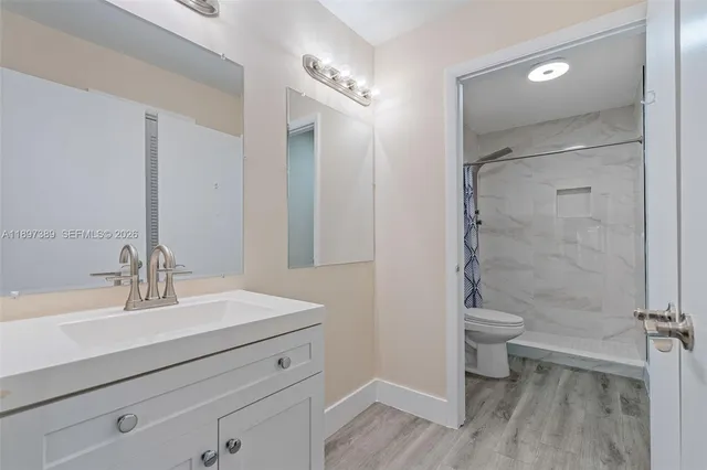 a bathroom with a shower and a toilet