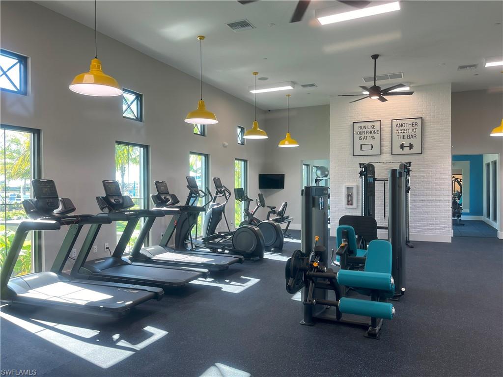 4580 Centaurus Circle Naples, FL 34120 - Photo 17 of 25 Exercise room with a high ceiling and a ceiling fan