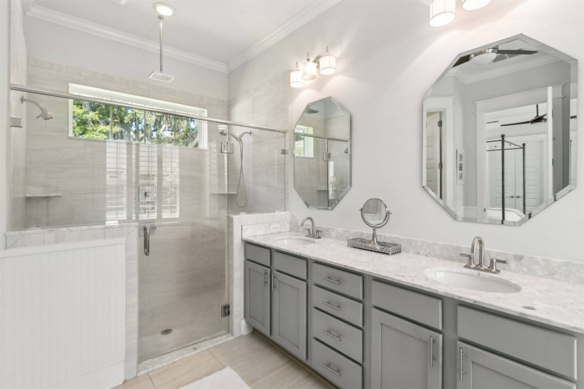 2930 Riverbend Walk Fernandina Beach, FL 32034 - Photo 22 of 60 a bathroom with a double vanity sink mirror and shower