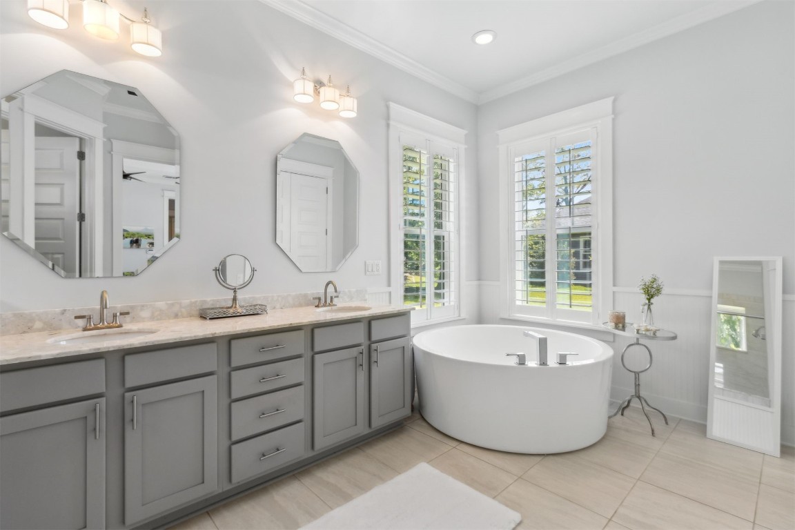 2930 Riverbend Walk Fernandina Beach, FL 32034 - Photo 23 of 60 a spacious bathroom with a double vanity sink bathtub mirror and window