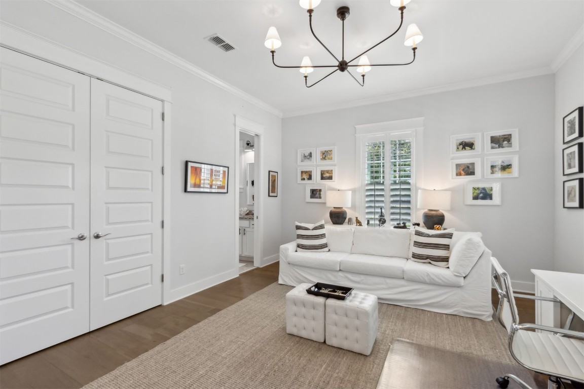 2930 Riverbend Walk Fernandina Beach, FL 32034 - Photo 29 of 60 a living room with furniture and a chandelier