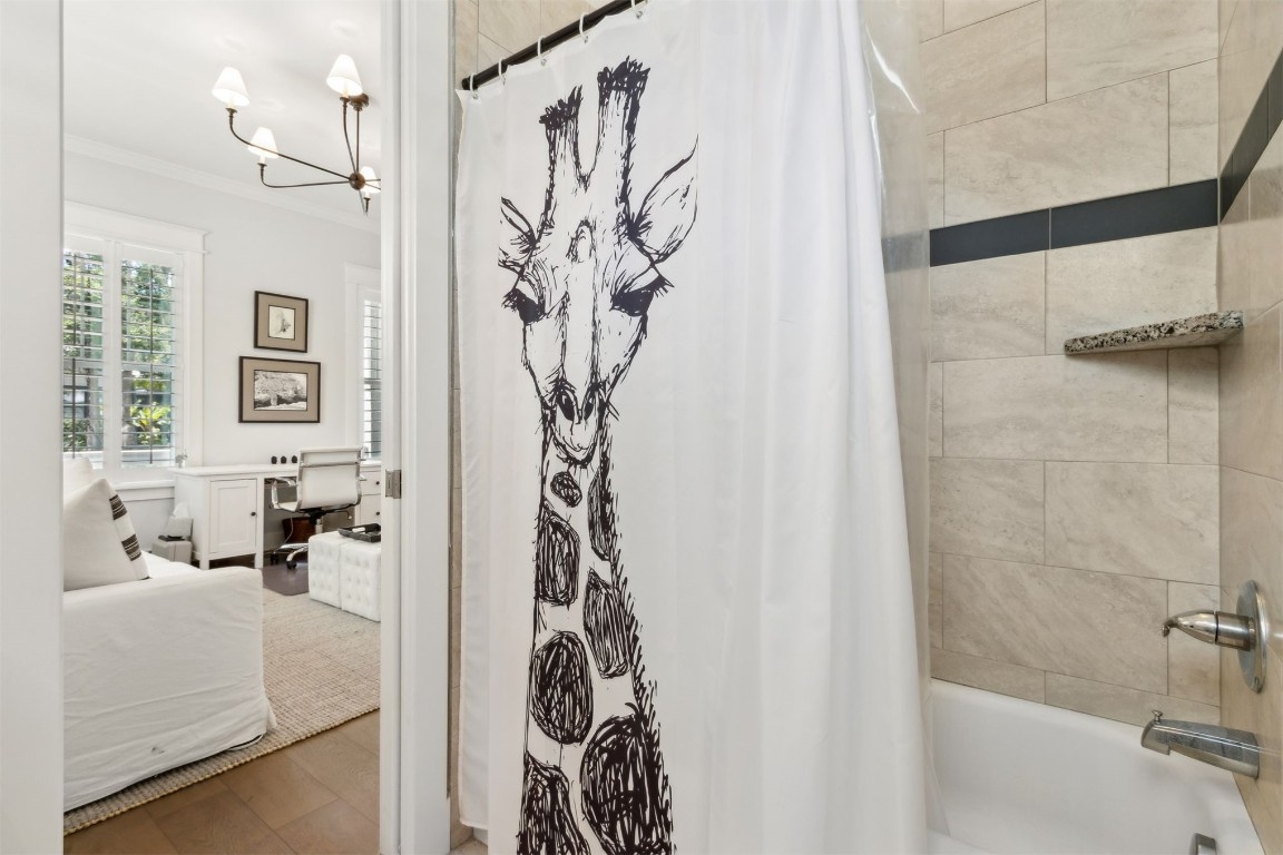 2930 Riverbend Walk Fernandina Beach, FL 32034 - Photo 33 of 60 a bathroom with a bathtub and shower curtain