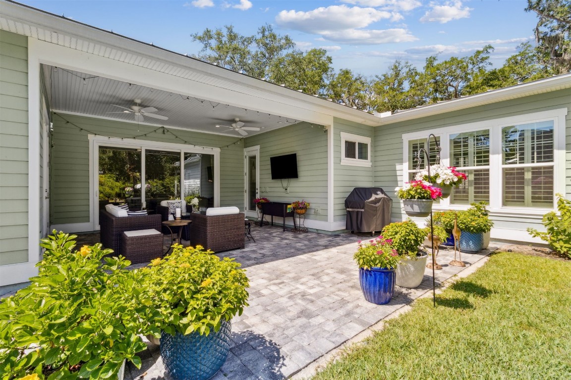 2930 Riverbend Walk Fernandina Beach, FL 32034 - Photo 53 of 60 a front view of a house with outdoor seating and a garden