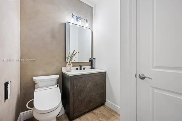 a living room with furniture window and wooden floor