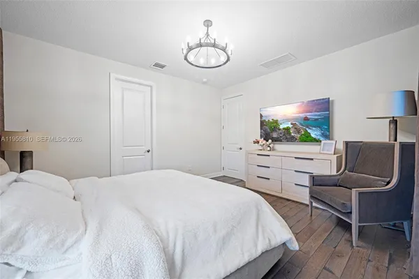 a bathroom with a sink a large mirror and a shower