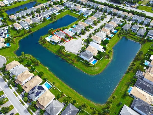an aerial view of a house with a swimming pool