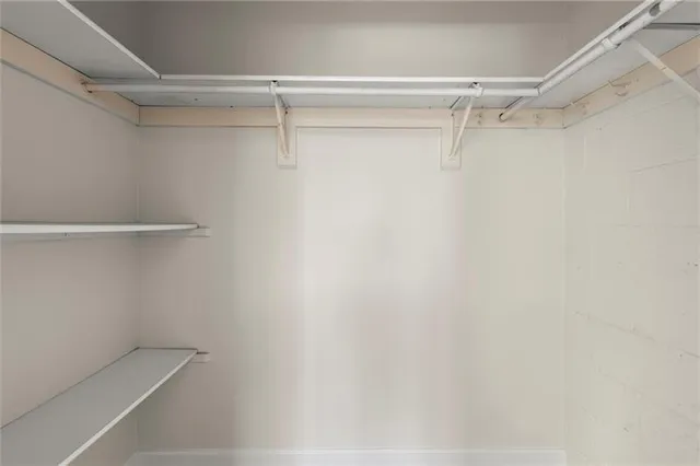 a building outdoor space with patio furniture and potted plants