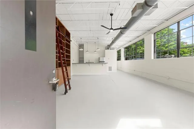 a kitchen with a table chairs and a stove