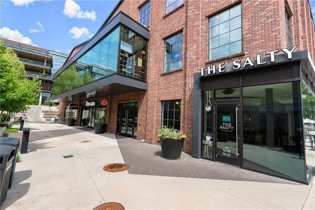 a view of a park with plants and a tree