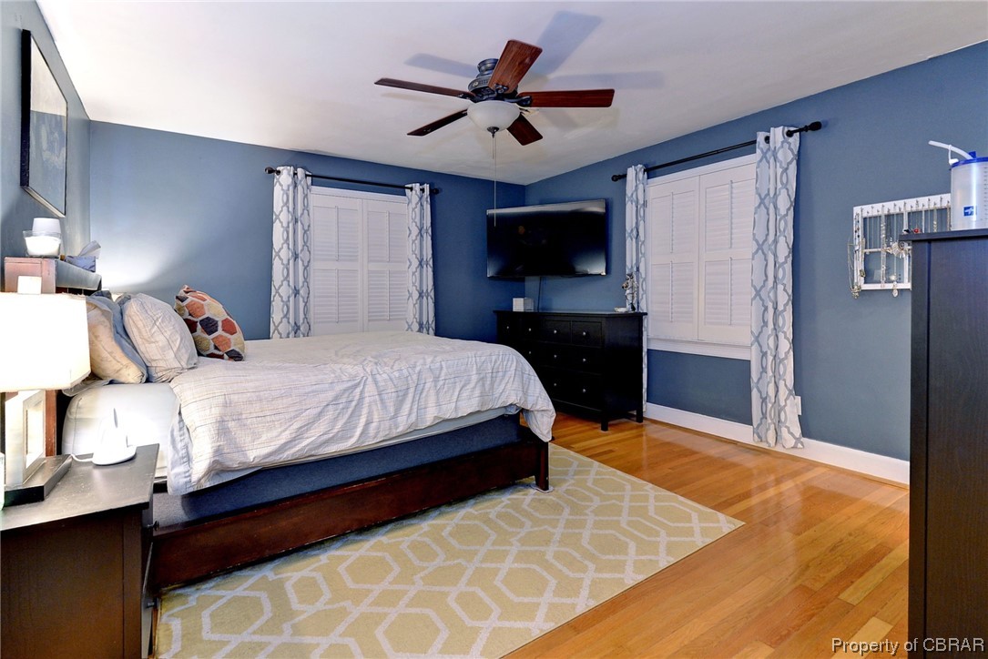 122 Selden Road Newport News, VA 23606 - Photo 16 of 38 Hardwood floored Primary bedroom with ceiling fan