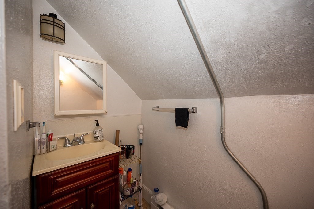 12 Prescott Street Springfield, MA 01108 - Photo 9 of 39 a bathroom with a sink and a mirror