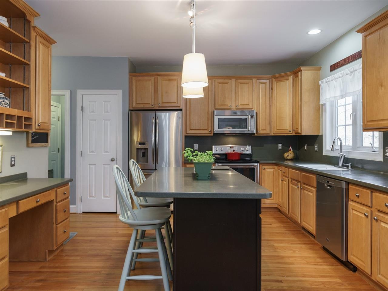 1105 Patterson Grove Road Apex, NC 27502 - Photo 6 of 25 Solid surface counters and stainless appliances complete the package in this well-designed kitchen. Kitchen