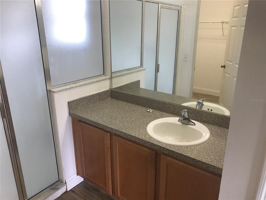 11156 Rouse Run Circle Orlando, FL 32817 - Photo 11 of 15 a bathroom with a sink and a mirror