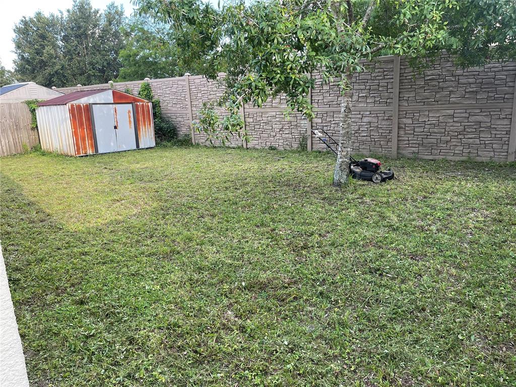 11156 Rouse Run Circle Orlando, FL 32817 - Photo 15 of 15 a view of a wall with an outdoor space