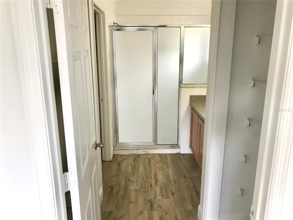 a view of a bathroom with a glass door