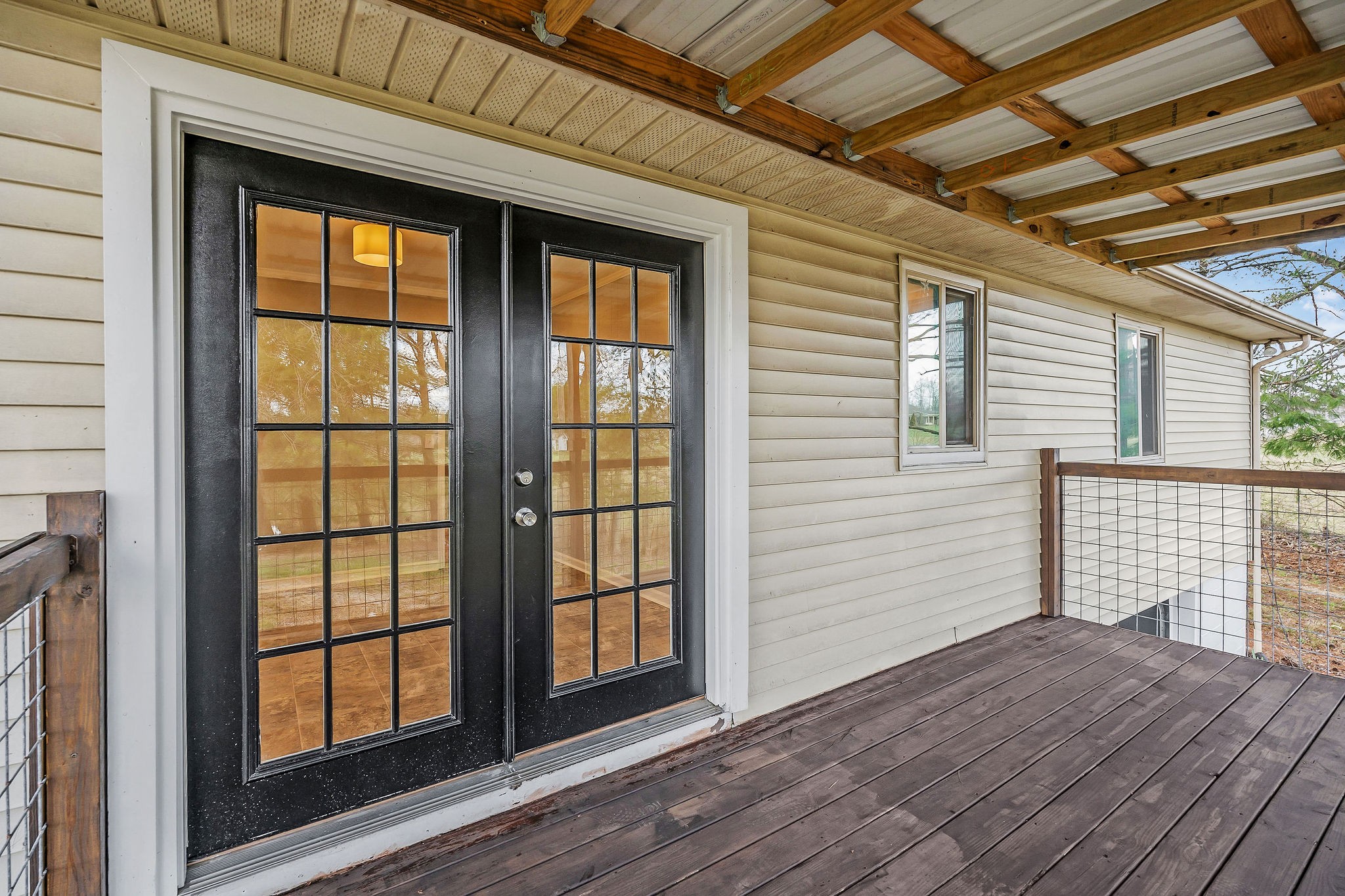 7159 Ditty Road Cookeville, TN 38506 - Photo 7 of 49 a view of empty room with wooden floor and fan