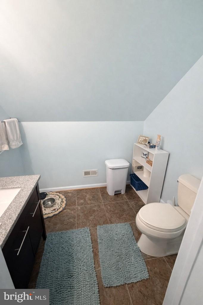 14137 Cedar Run Road Culpeper, VA 22701 - Photo 29 of 30 a bathroom with a granite countertop toilet and a sink