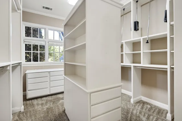 a view of an empty walk in closet