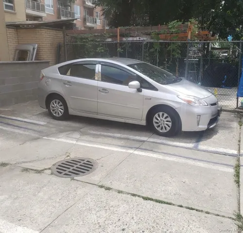 a view of parking area of a house