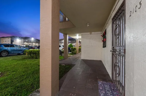 a view of a porch with seating space