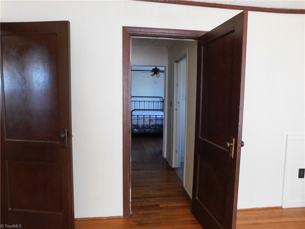 153 Regal Road State Road, NC 28676 - Photo 12 of 23 Hallway with closet to bath and 2nd bedroom