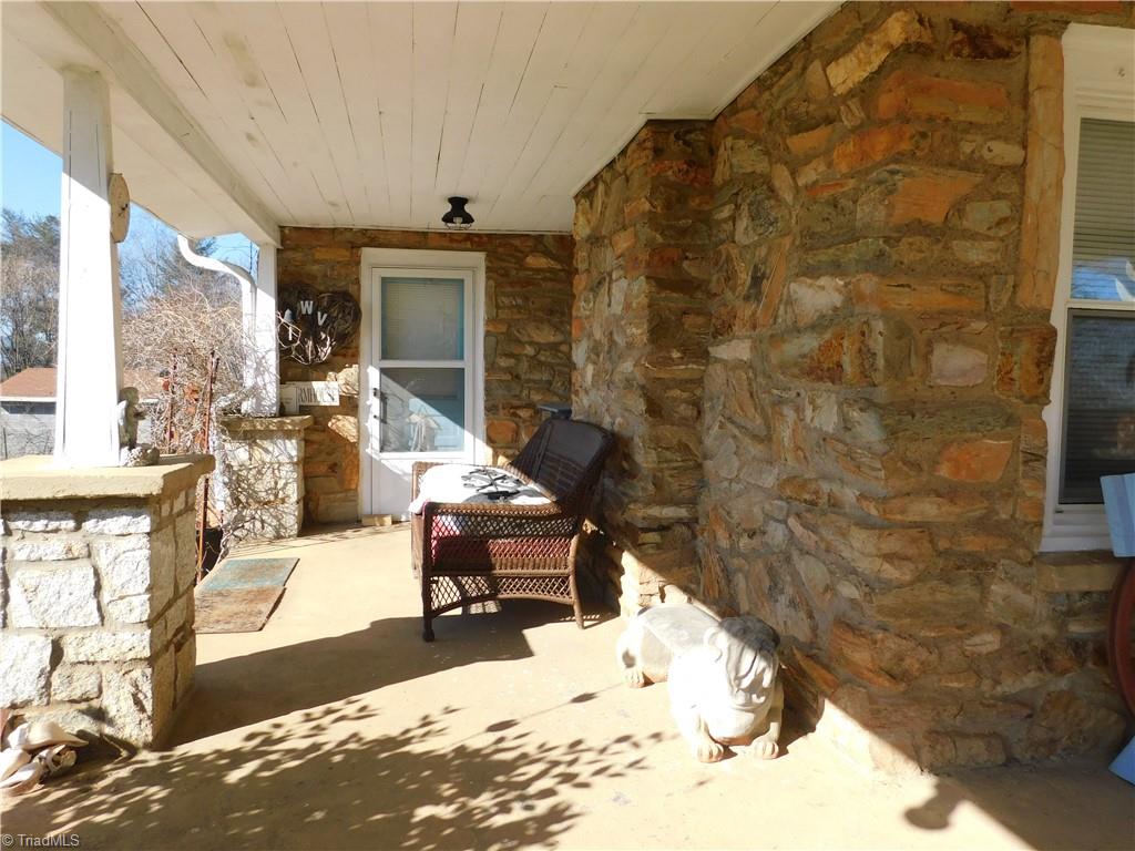 153 Regal Road State Road, NC 28676 - Photo 21 of 23 Wrap around covered porch and side entrance