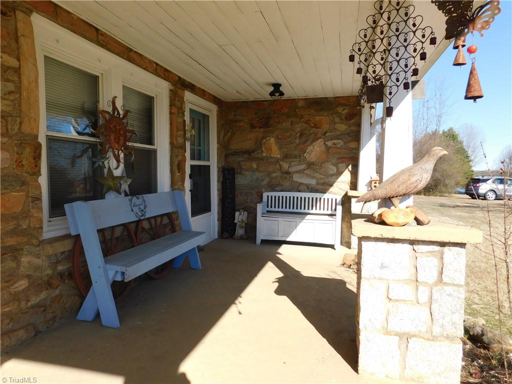 153 Regal Road State Road, NC 28676 - Photo 22 of 23 Wrap around covered porch and front entrance