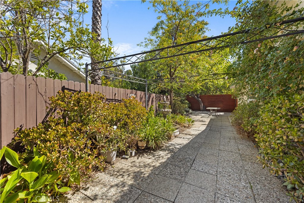 26096 Adamor Road Calabasas, CA 91302 - Photo 59 of 61 Unusually large side yard with lush landscaping, trellis, 6' diameter tradition fountain, and plenty of additional patio space.
