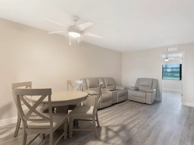 a view of a livingroom with furniture and wooden floor