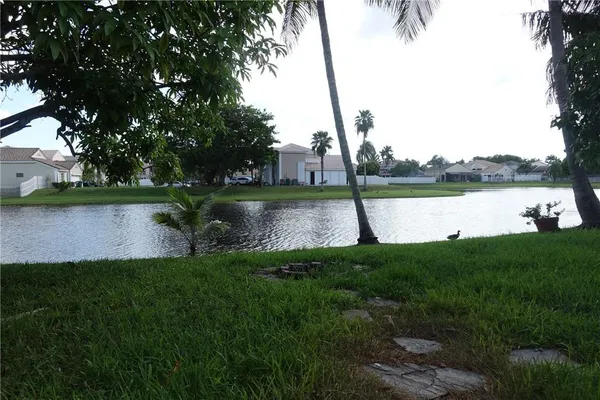 a view of a lake with a garden