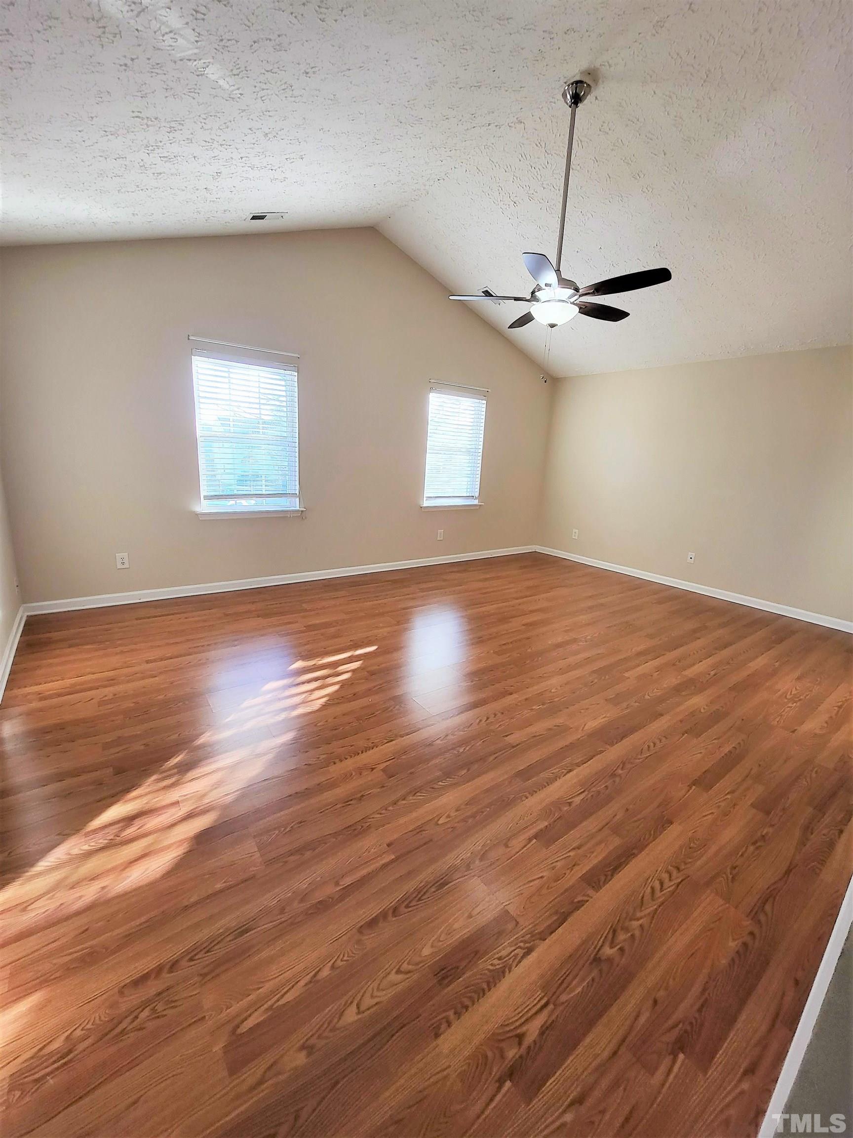 4237 Palafox Court Raleigh, NC 27604 - Photo 11 of 20 a view of empty room with wooden floor