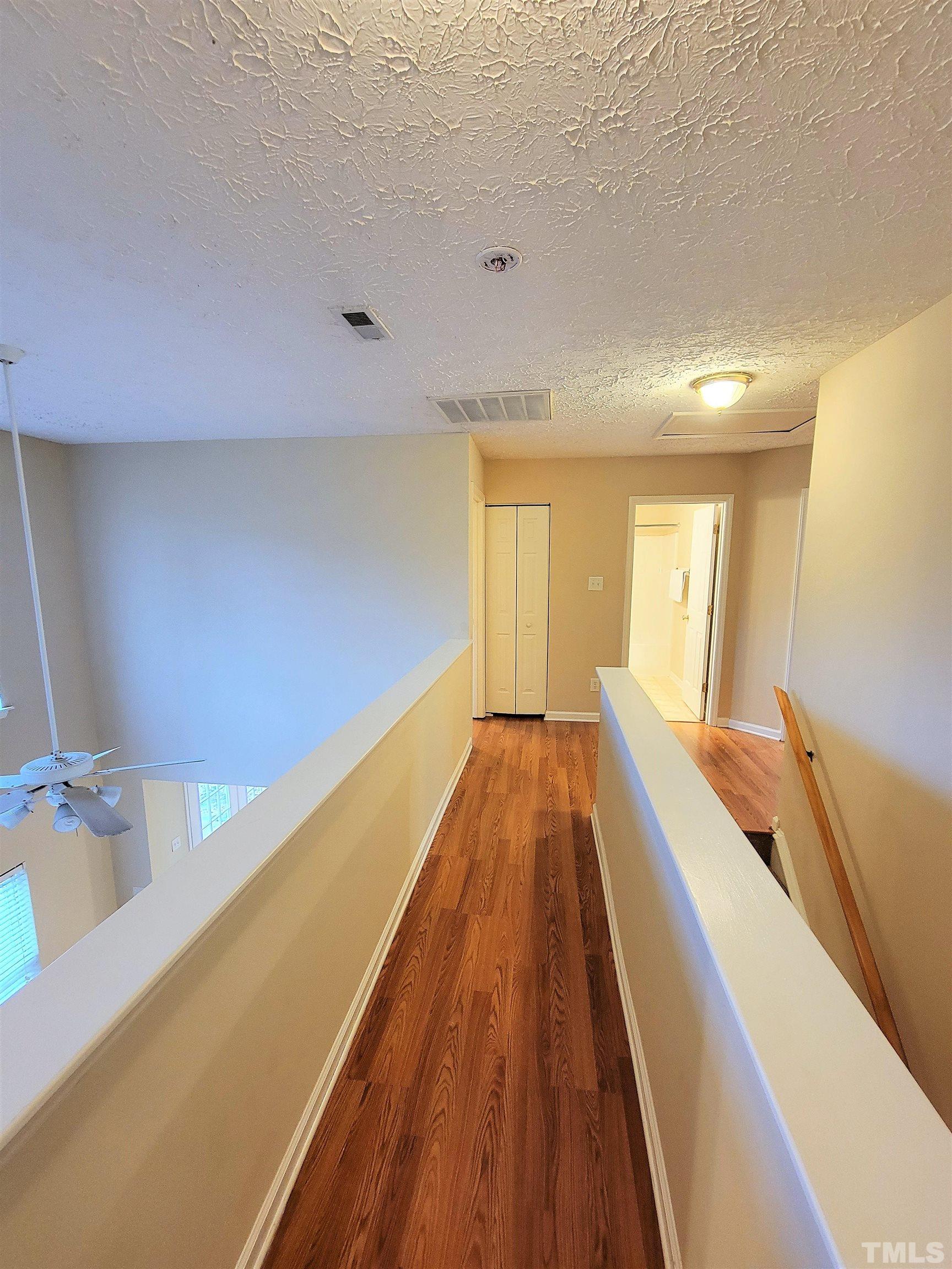 4237 Palafox Court Raleigh, NC 27604 - Photo 16 of 20 a view of a bedroom with wooden floor