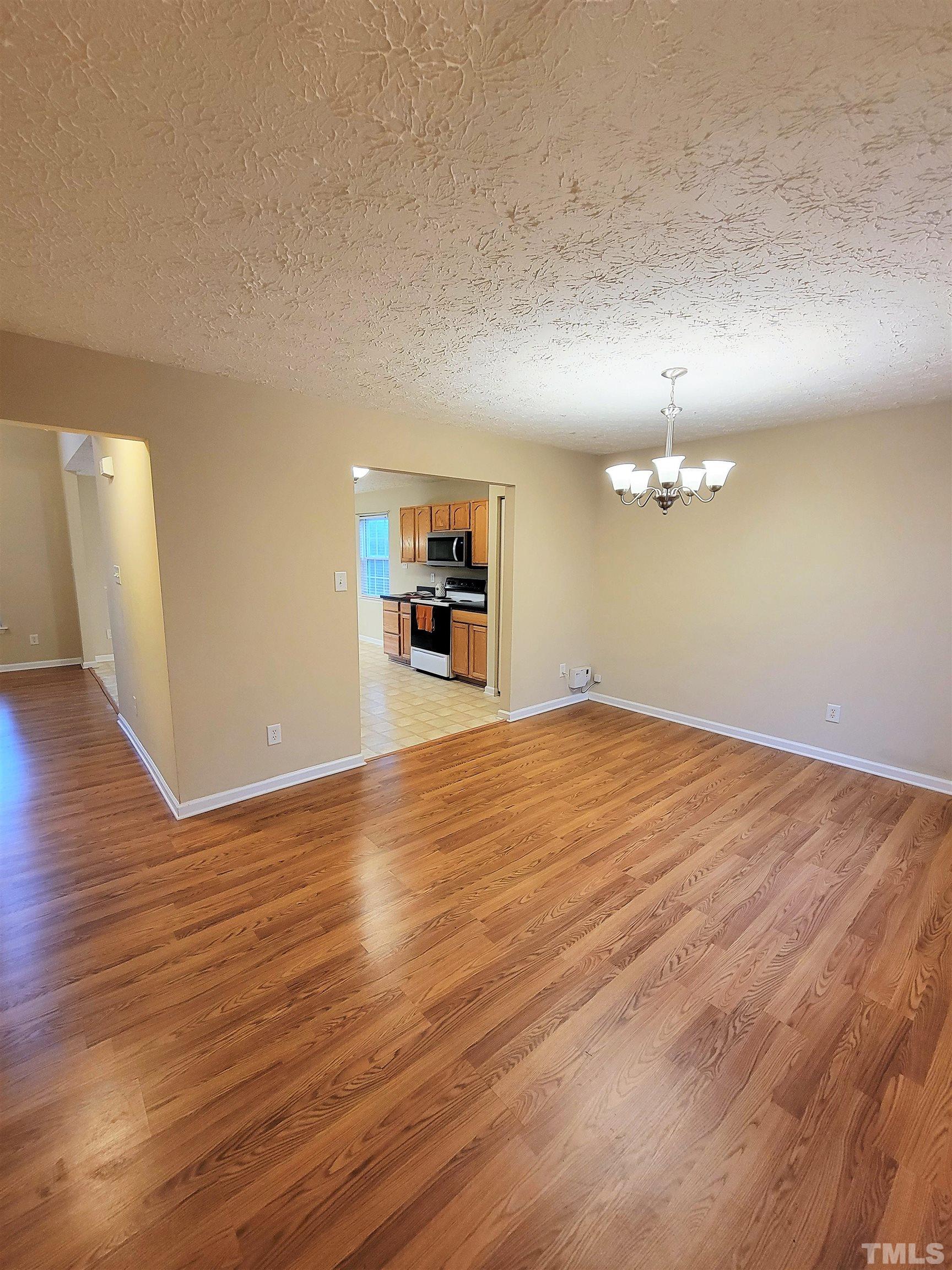 4237 Palafox Court Raleigh, NC 27604 - Photo 6 of 20 a view of a room with wooden floor