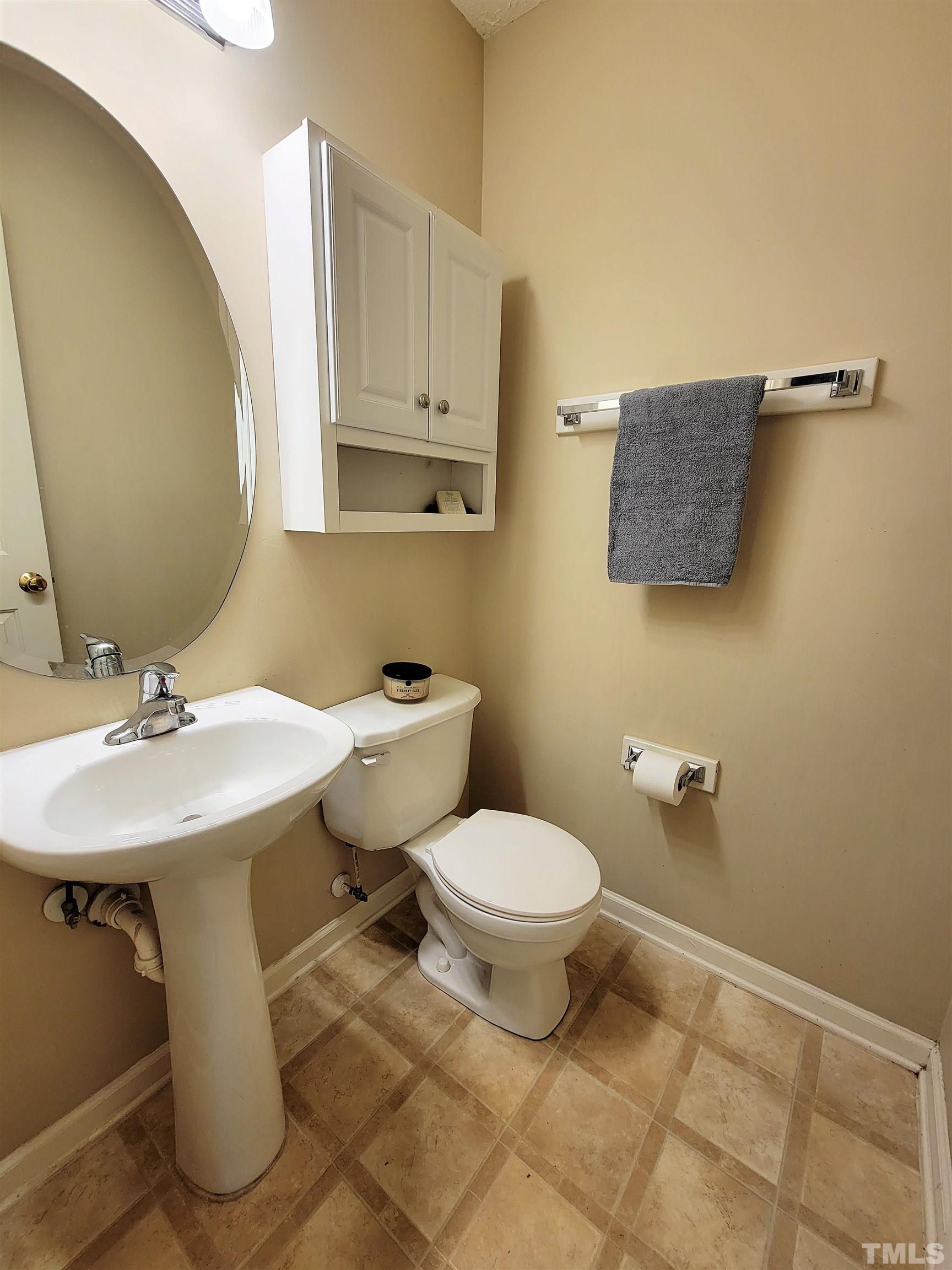 4237 Palafox Court Raleigh, NC 27604 - Photo 10 of 20 a bathroom with a sink toilet and mirror