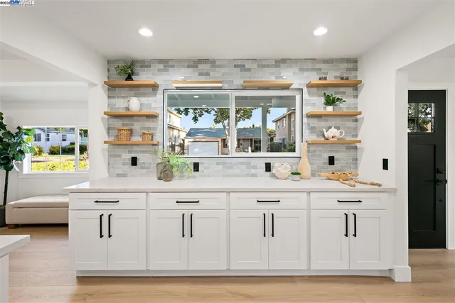 a kitchen with a table and chairs