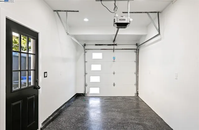 a bathroom with a sink mirror and shower