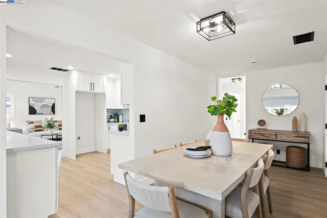 a bathroom with a sink mirror vanity and toilet