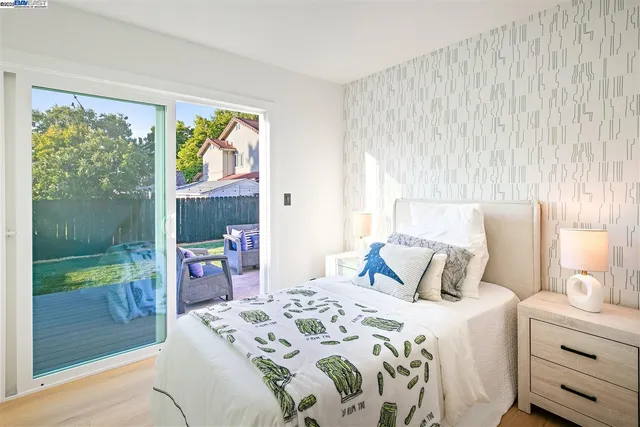 a bedroom with a bed and a potted plant