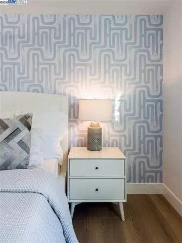 a view of a patio with table and chairs with wooden floor and fence