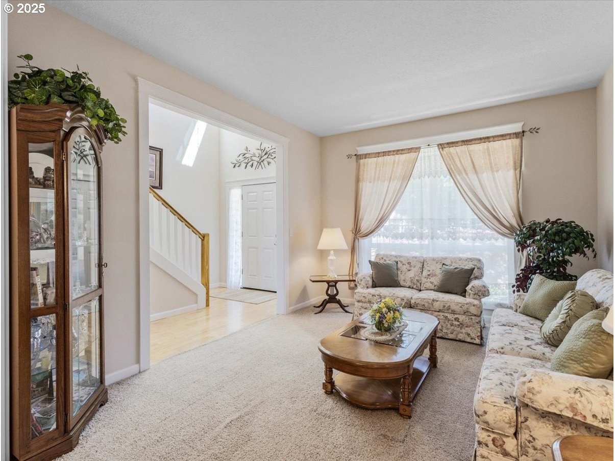 863 June Drive Molalla, OR 97038 - Photo 12 of 36 a living room with furniture and a large window