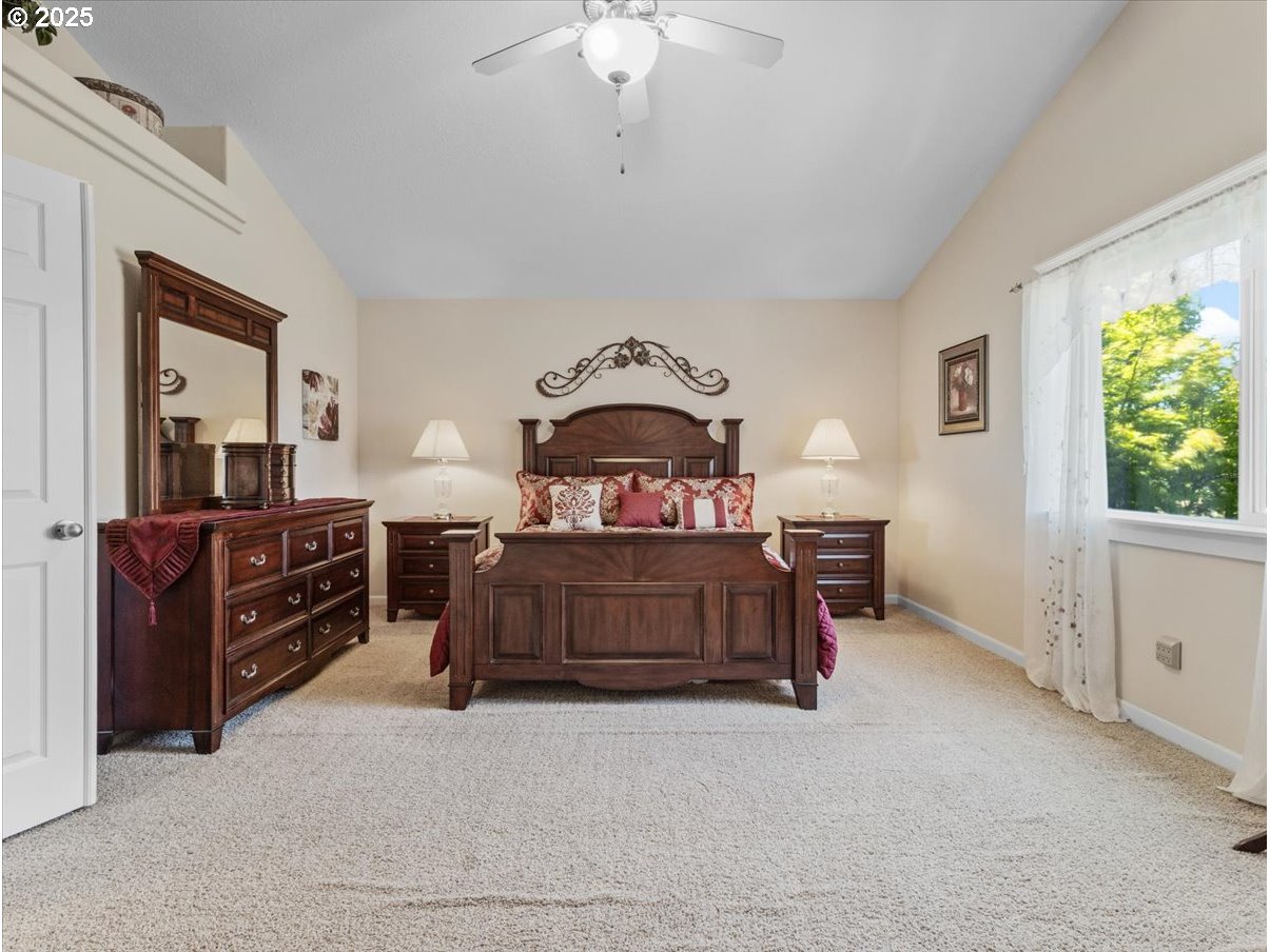 863 June Drive Molalla, OR 97038 - Photo 13 of 36 a bedroom with a bed and a chandelier