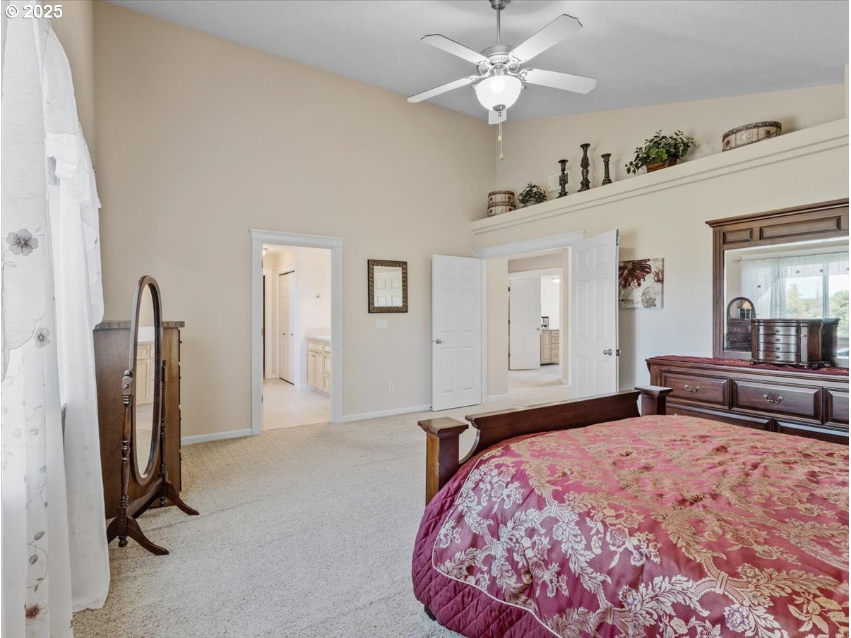 863 June Drive Molalla, OR 97038 - Photo 14 of 36 a bedroom with furniture and a large window