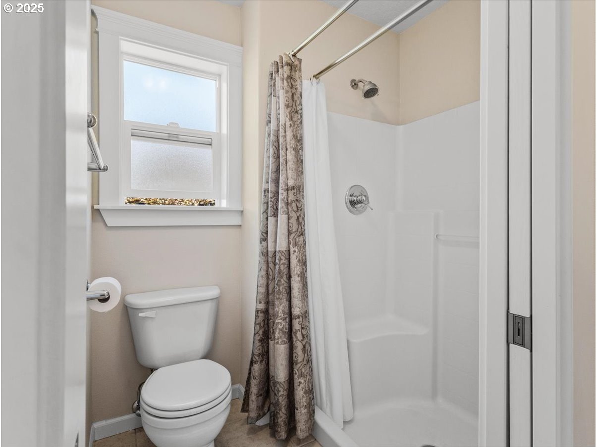 863 June Drive Molalla, OR 97038 - Photo 17 of 36 a bathroom with a toilet and a shower