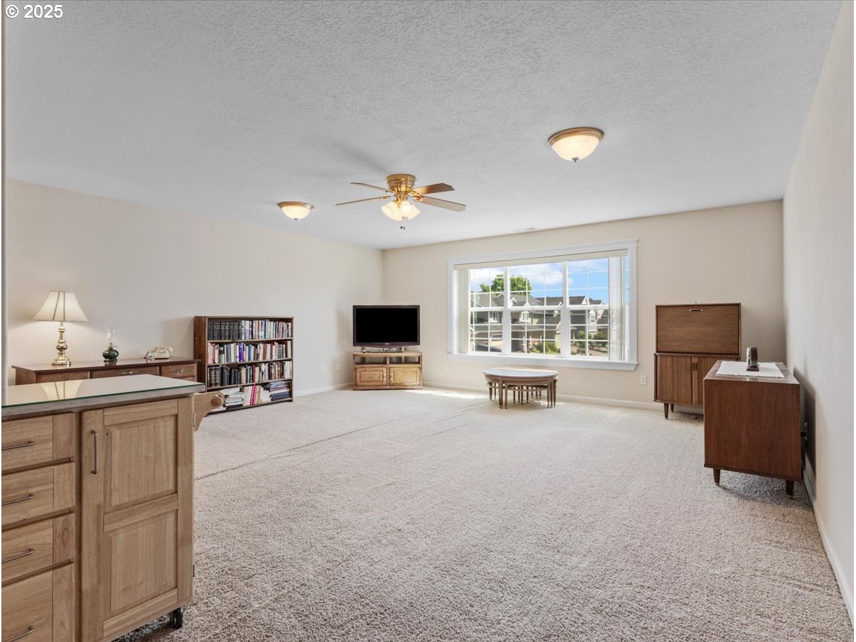 863 June Drive Molalla, OR 97038 - Photo 18 of 36 a living room with furniture and a flat screen tv