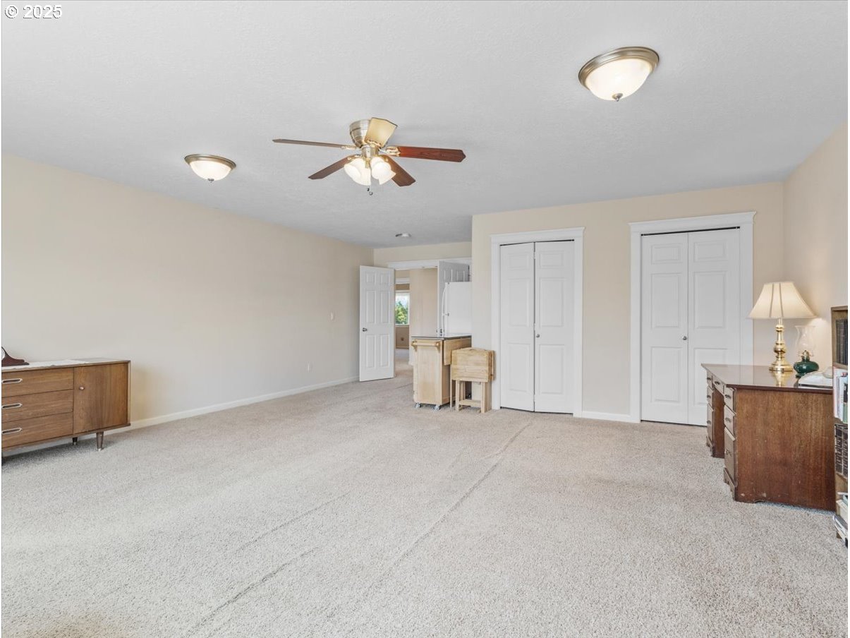 863 June Drive Molalla, OR 97038 - Photo 19 of 36 a view of empty room with ceiling fan
